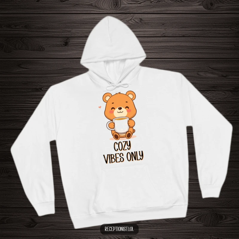 Funny bear hoodie with a smiling character offering a steaming cup of tea, exuding warmth, comfort, and a touch of playful charm.