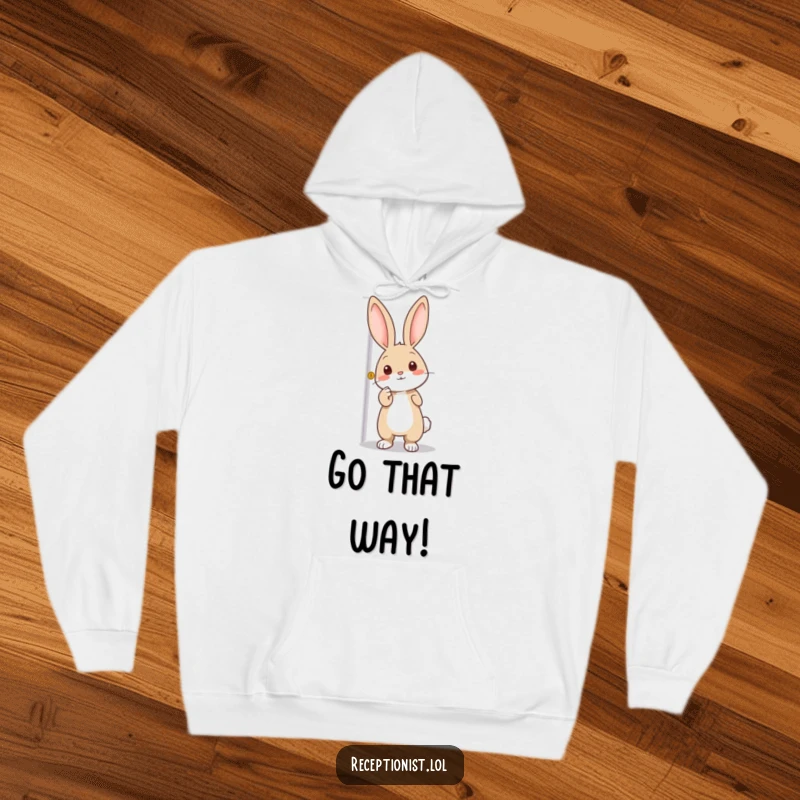 Funny hoodie with an enthusiastic rabbit pointing towards a door, symbolizing the call to adventure and cozy exploration.